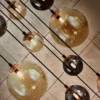 Lámpara colgante Dark – Schuller – Lámpara con 14 luces, tulipas de cristal ámbar y gris